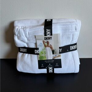 DKNY bath wrap towel. One size fits most. Has pockets. White. Adjustable Velcro